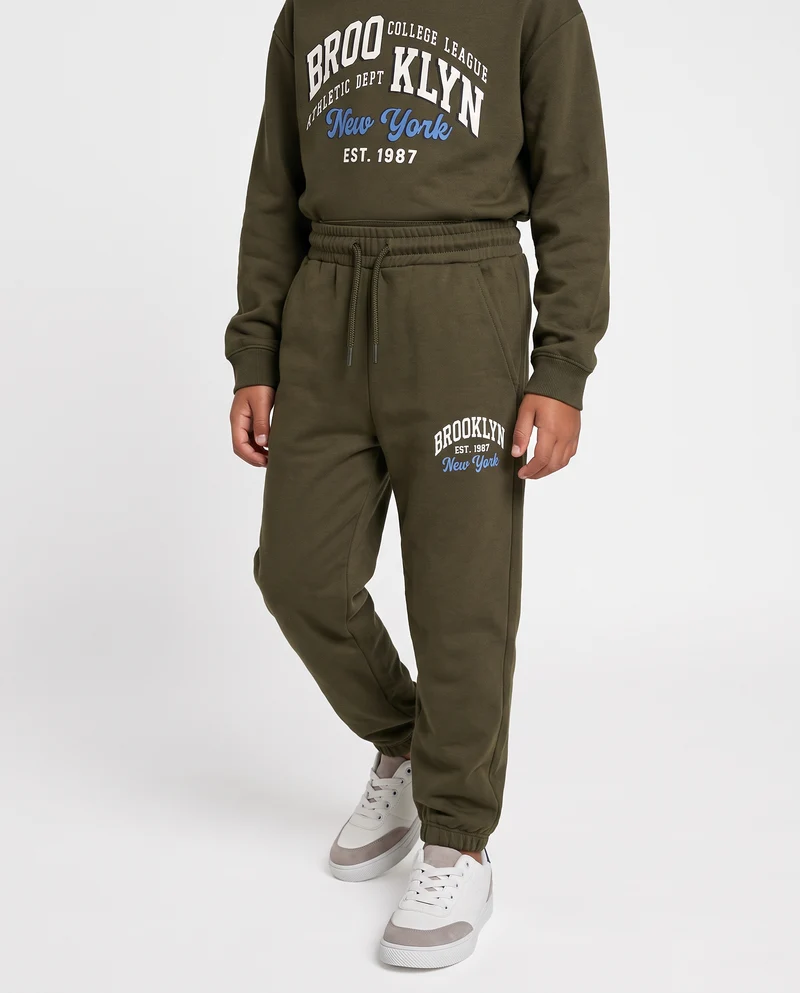 Jogger in felpa con stampa college - Verde militare