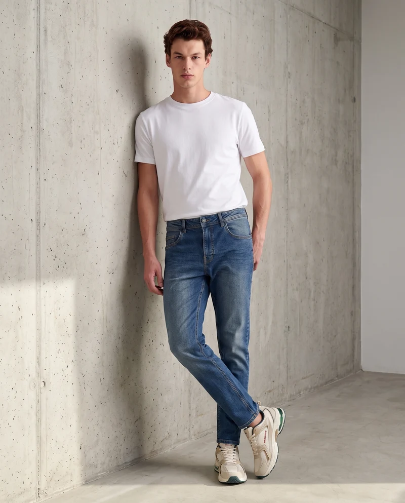 Jeans slim tapered fit blu medio effetto slavato - Denim