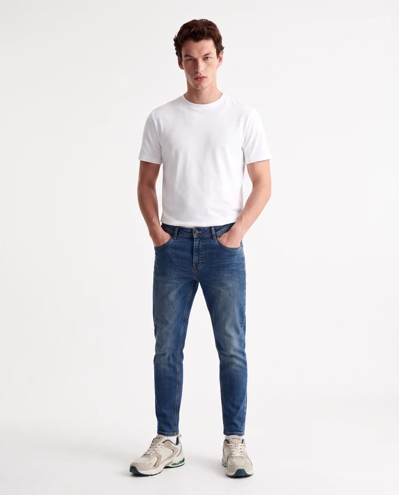 Jeans slim tapered fit blu medio effetto slavato - Denim