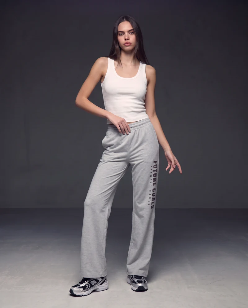 Pantaloni tuta dritti con coulisse e stampa - Grigio mel.