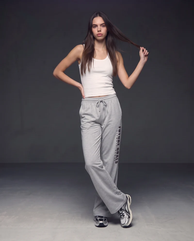 Pantaloni tuta dritti con coulisse e stampa - Grigio mel.