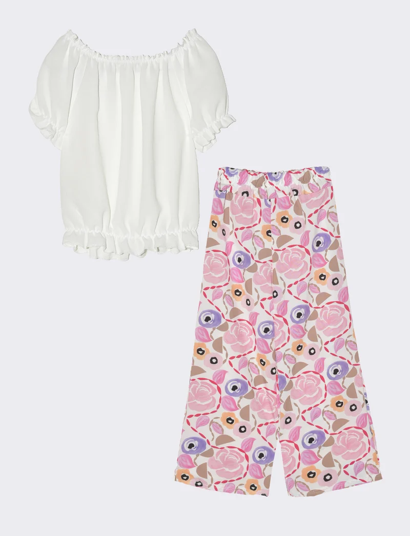 Completo da bambina con blusa e pantaloni fantasia. - Rosa